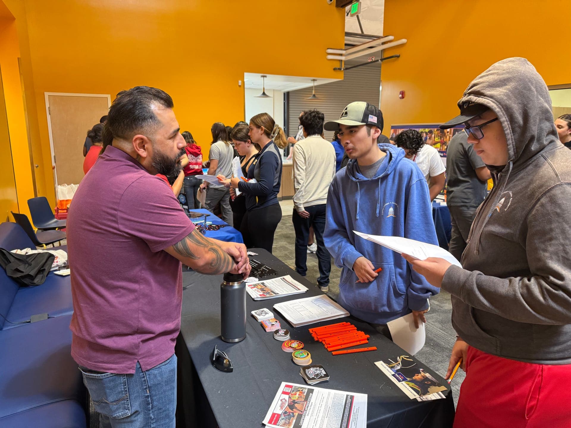 An industry partner meeting students at a CCCA Works! career fair