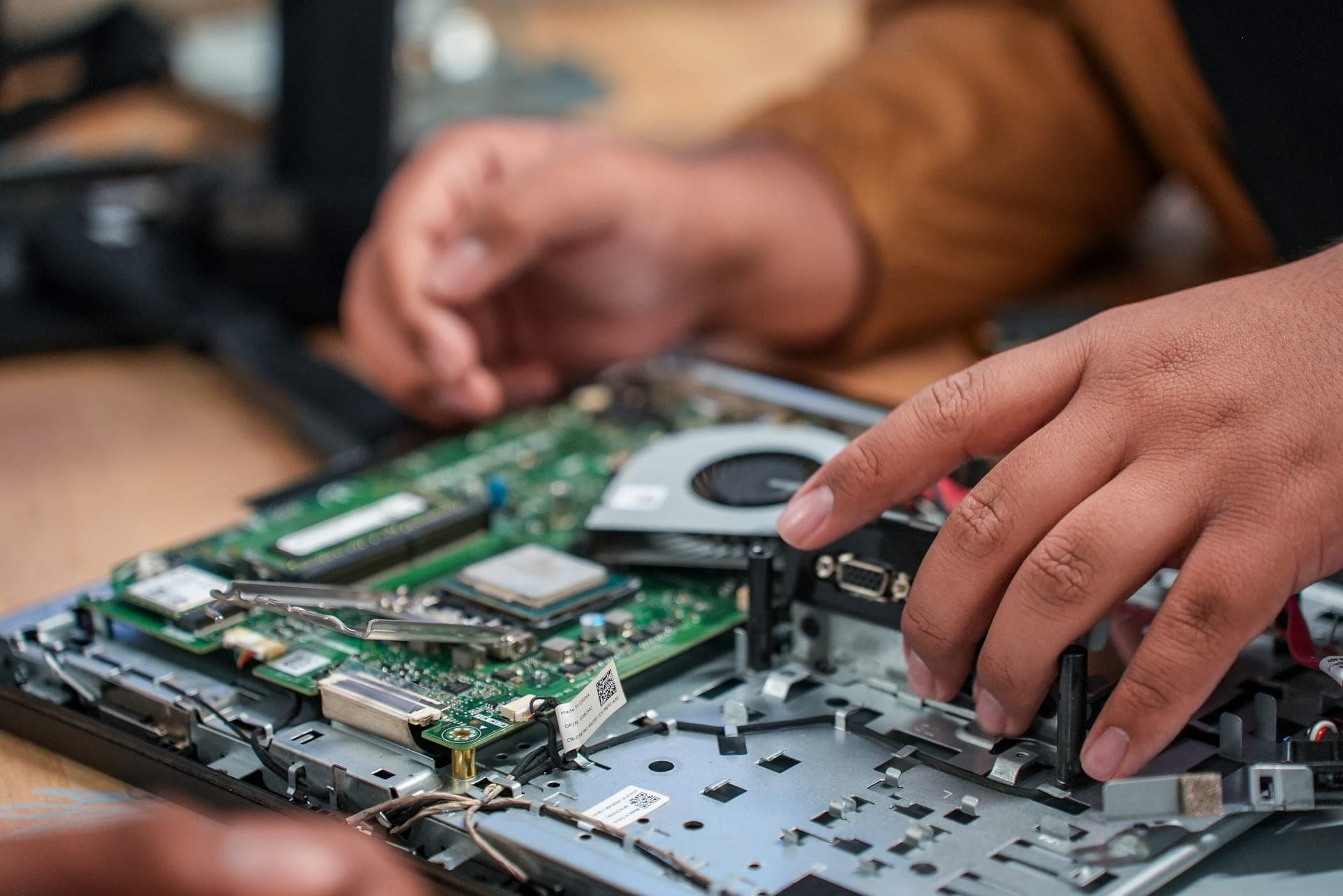 Close-up of a student working on a circuit board