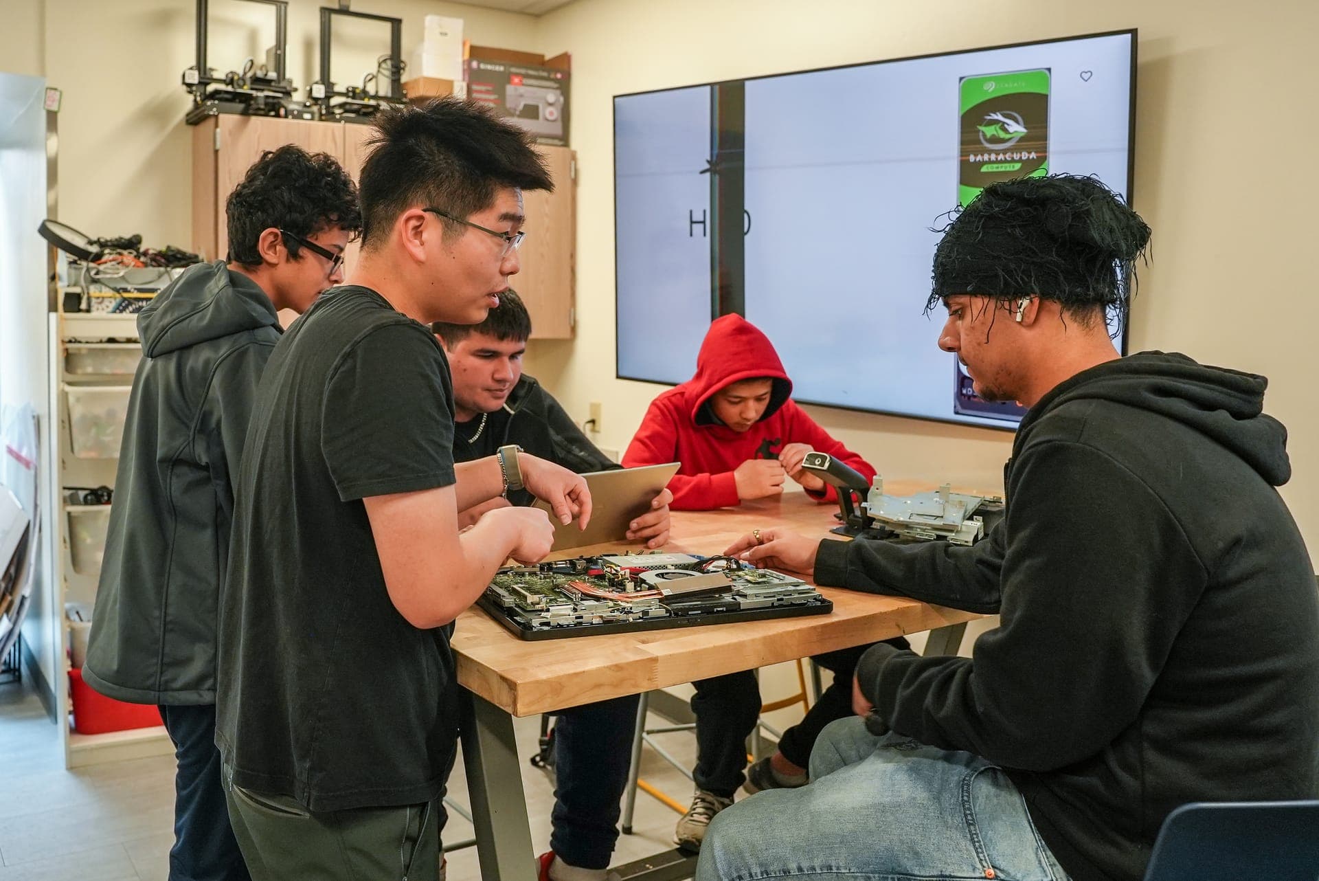 Students collaborating on a hands-on technology project