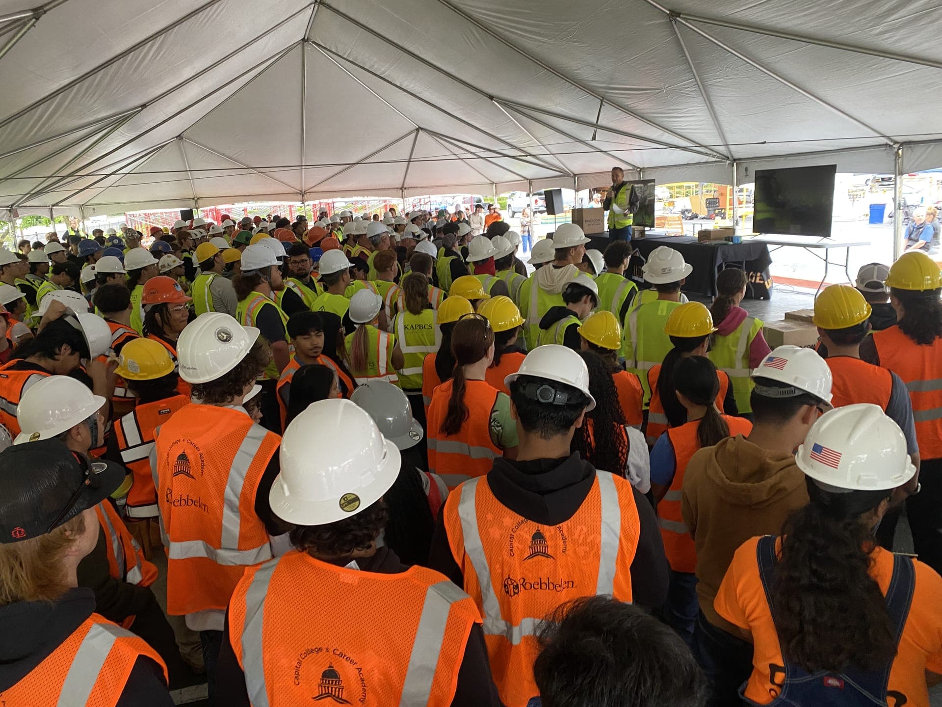 Students in hard hats and safety vests at a CCCA Works! trades day